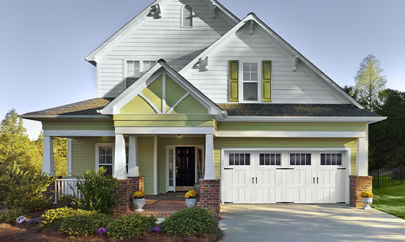 a house with a white garage door | residential garage door service