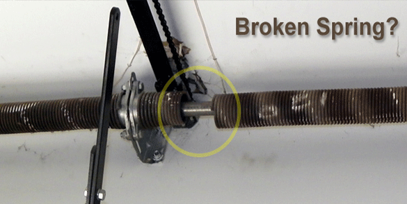 Image showing a snapped garage door spring circled in yellow, a common issue requiring professional garage door repair.